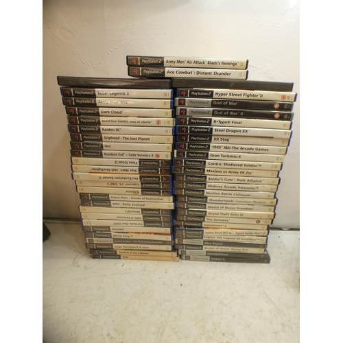 2163b - Two PS2 consoles, approx 40 games and accessories including rare games