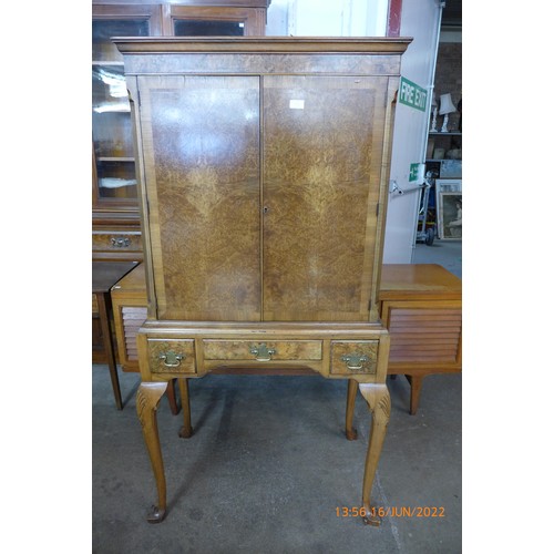 110c - A Queen Anne style walnut cocktail cabinet