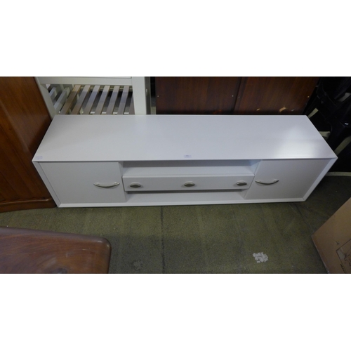 1677 - A white two door, one drawer TV/media unit