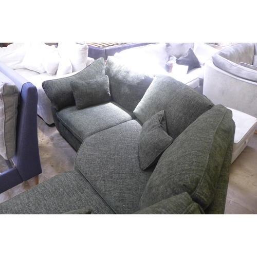 1523 - A moss green fabric curved corner sofa