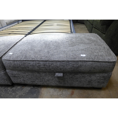 1530 - A dark grey upholstered ottoman footstool