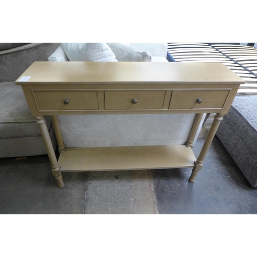 1534 - A gold three drawer console table