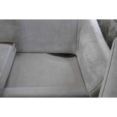 1569 - A Halley Dolce aluminium velvet three seater sofa - damaged