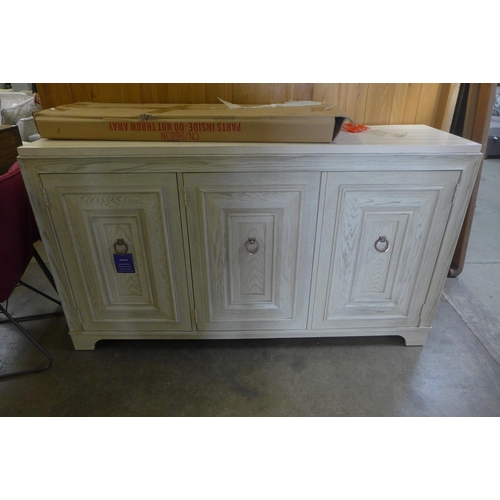 1667 - A white painted washed oak and marble top three door sideboard