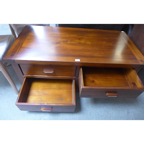 1689 - A cherrywood four drawer rectangular coffee table