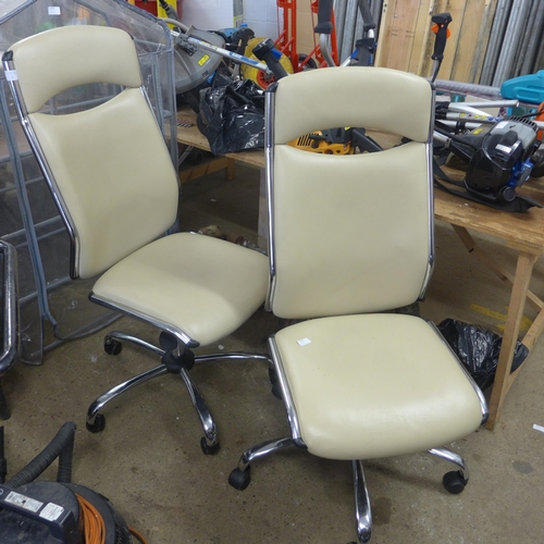 2338 - Two cream leather/chrome cantilever rise/reclining chairs