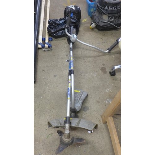 2341 - MacAllister petrol strimmer with strimmer head and metal blade head - W