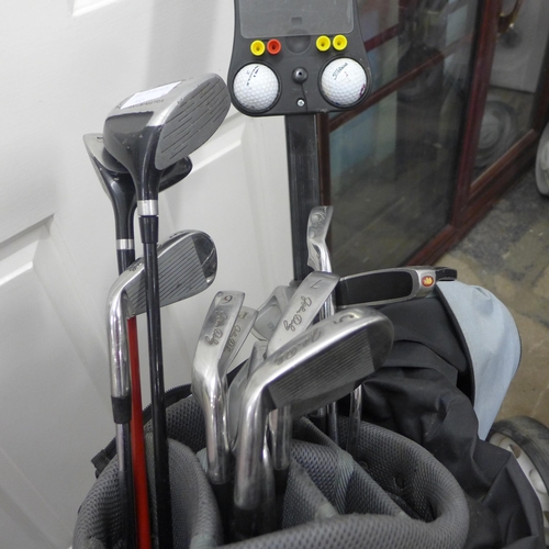 2276 - Hippo John Daly golf set with trolley and approx 10 golf clubs