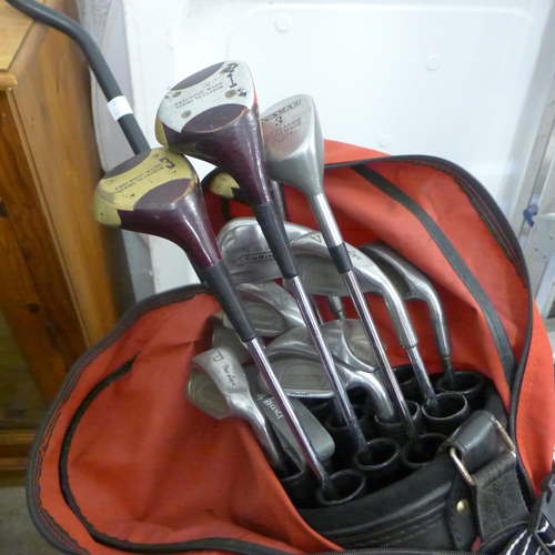 2278 - Full set of golf clubs in Letters trolley