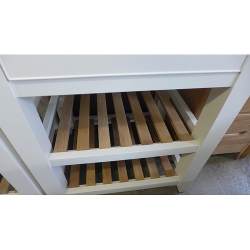 1996 - A white painted small kitchen island unit with a beech top