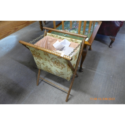 190 - An oak nest of tables, an oak stool, a folding sewing box and an oak embroidery topped coffee table