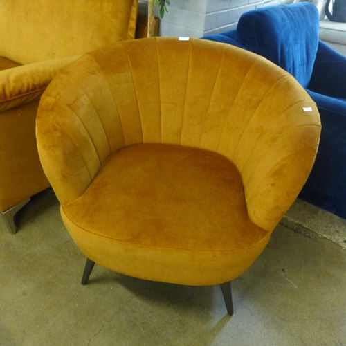 1438 - An ochre velvet shell tub chair