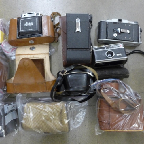 1202 - A box of cameras including a Kershaw folding camera, box cameras and other folding cameras **PLEASE ... 