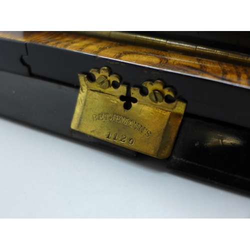 674 - An early 19th Century burr elm book slide, marked Betjemann's on the hinge, retailer's brass plaque ... 