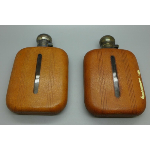 680 - Two leather covered hip flasks with plated tops