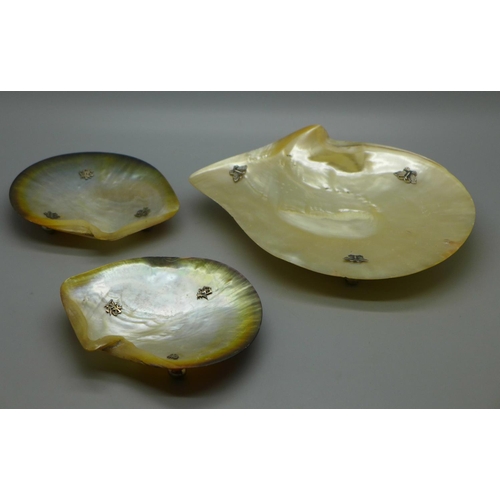 682 - Three mother of pearl and white metal caviar dishes