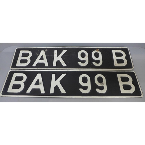 688 - A pair of 20th Century car number plates, BAK 99 B