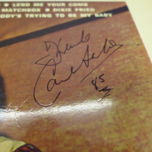 703 - Rock n Roll; a Carl Perkins signed LP