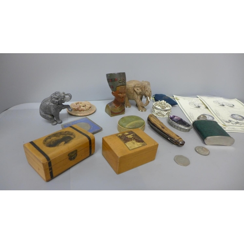 738 - A hip flask, boxes, small carved Egyptian statue, two silver plated Winnie The Pooh 50p coins with c... 