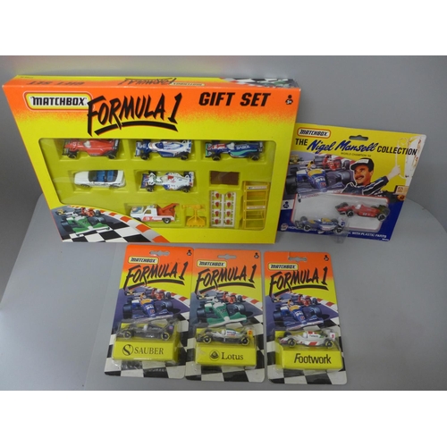 754 - Three Matchbox Formula One cars in blister packs, a rare Nigel Mansell Collection two car set and a ... 