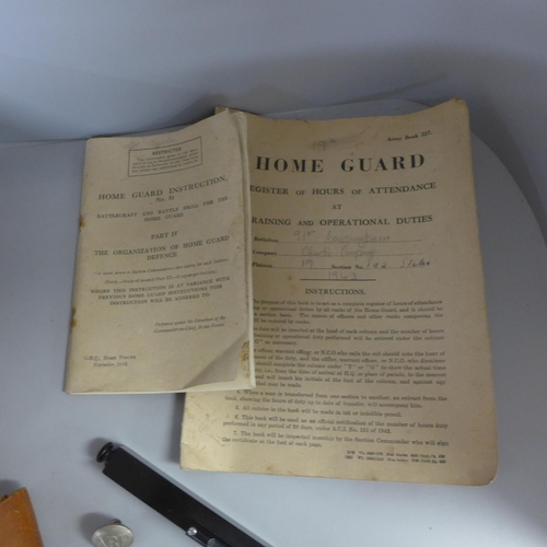 811 - A Home Guard wooden box with applied badges, two booklets and a military Hilgar and watch range find... 