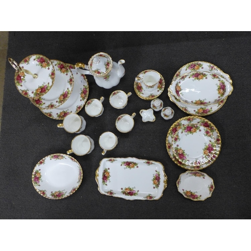 831 - A Royal Albert Old Country Roses part coffee set, a three tier cakestand, tea plates, side plates, e... 