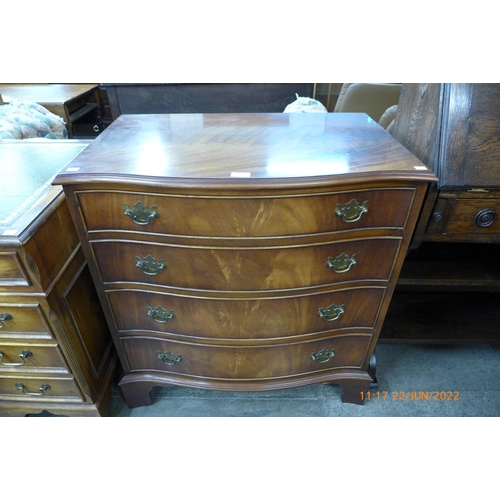 106 - A George III style mahogany serpentine chest of drawers