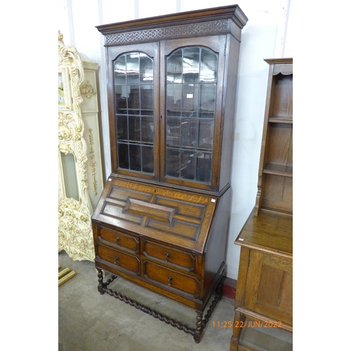 112 - An early 20th Century oak bureau bookcase