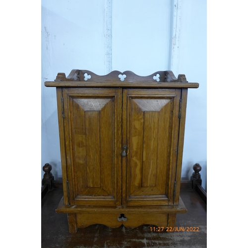 116 - A Victorian Gothic Revival carved oak table top cabinet