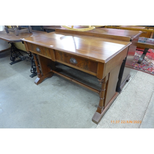 132 - A Victorian mahogany two drawer writing table