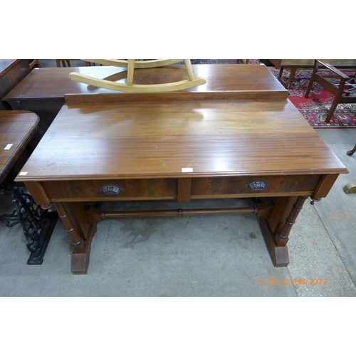 132 - A Victorian mahogany two drawer writing table