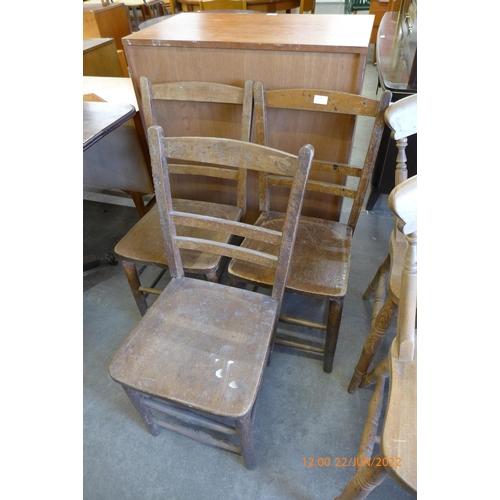 149 - A set of three early 20th Century beech kitchen chairs