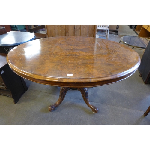 201 - A Victorian figured walnut oval tilt-top breakfast table