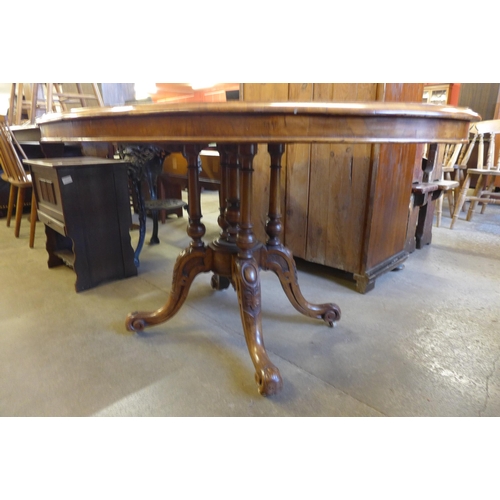 201 - A Victorian figured walnut oval tilt-top breakfast table