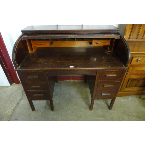 229 - An early 20th Century oak tambour roll top desk