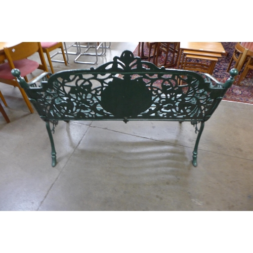 275 - A Victorian style painted cast iron garden bench