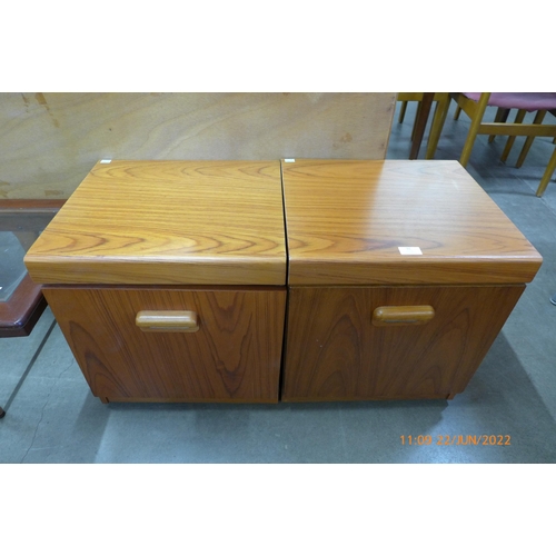 91 - A pair of simulated teak bedside table cabinets