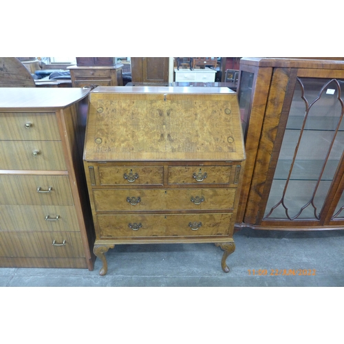 93 - A Queen Anne style figured walnut bureau