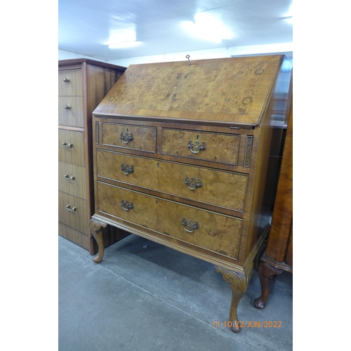 93 - A Queen Anne style figured walnut bureau