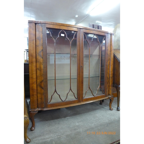 94 - A figured walnut display cabinet