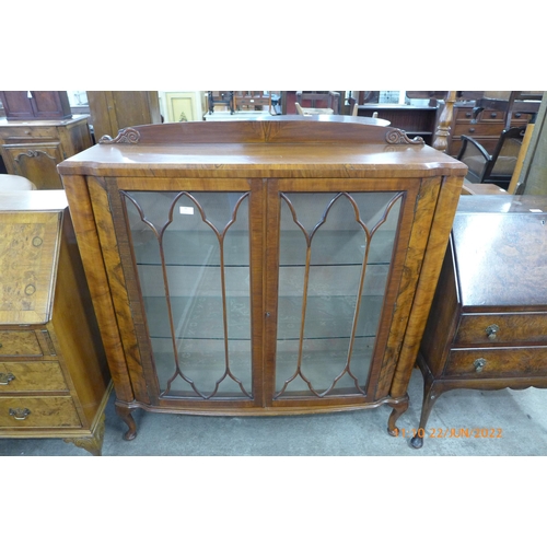 94 - A figured walnut display cabinet