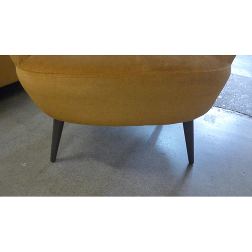 1438 - An ochre velvet shell tub chair