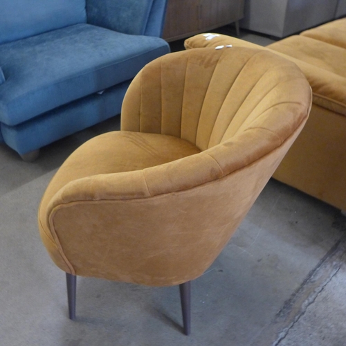 1438 - An ochre velvet shell tub chair