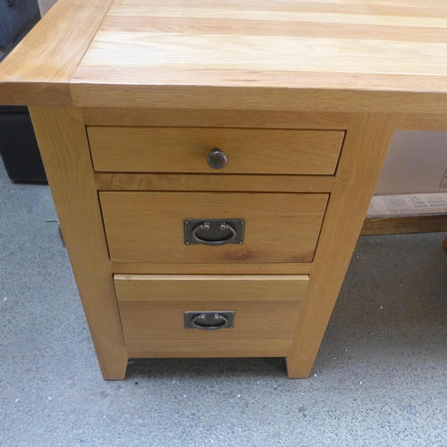 1716 - An oak four drawer desk