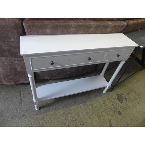 1722 - A white three drawer console table - marked