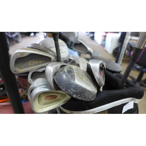 2170 - A golf bag with various irons and woods