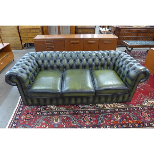 50 - A green leather Chesterfield settee