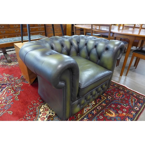 51 - A green leather Chesterfield club chair