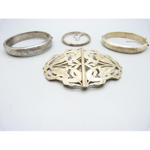 1000 - Two hallmarked silver bangles, a small 925 silver bangle and a silver buckle hallmarked Birmingham 1... 