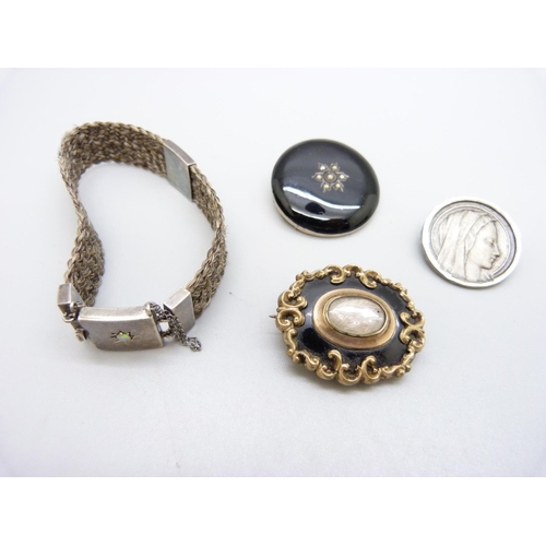 1001 - A hair mourning bracelet set with an opal, two mourning brooches and one other brooch